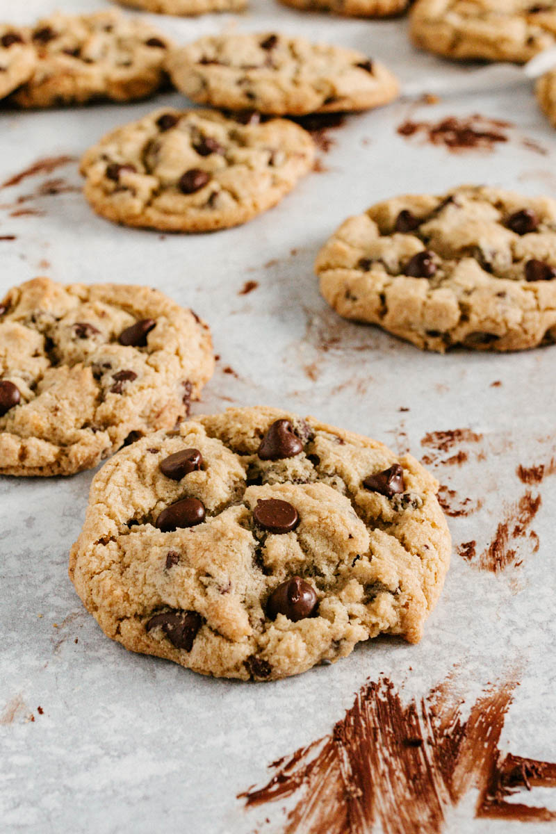 taste before beauty number one best chocolate chip cookie on table with chocolate smears