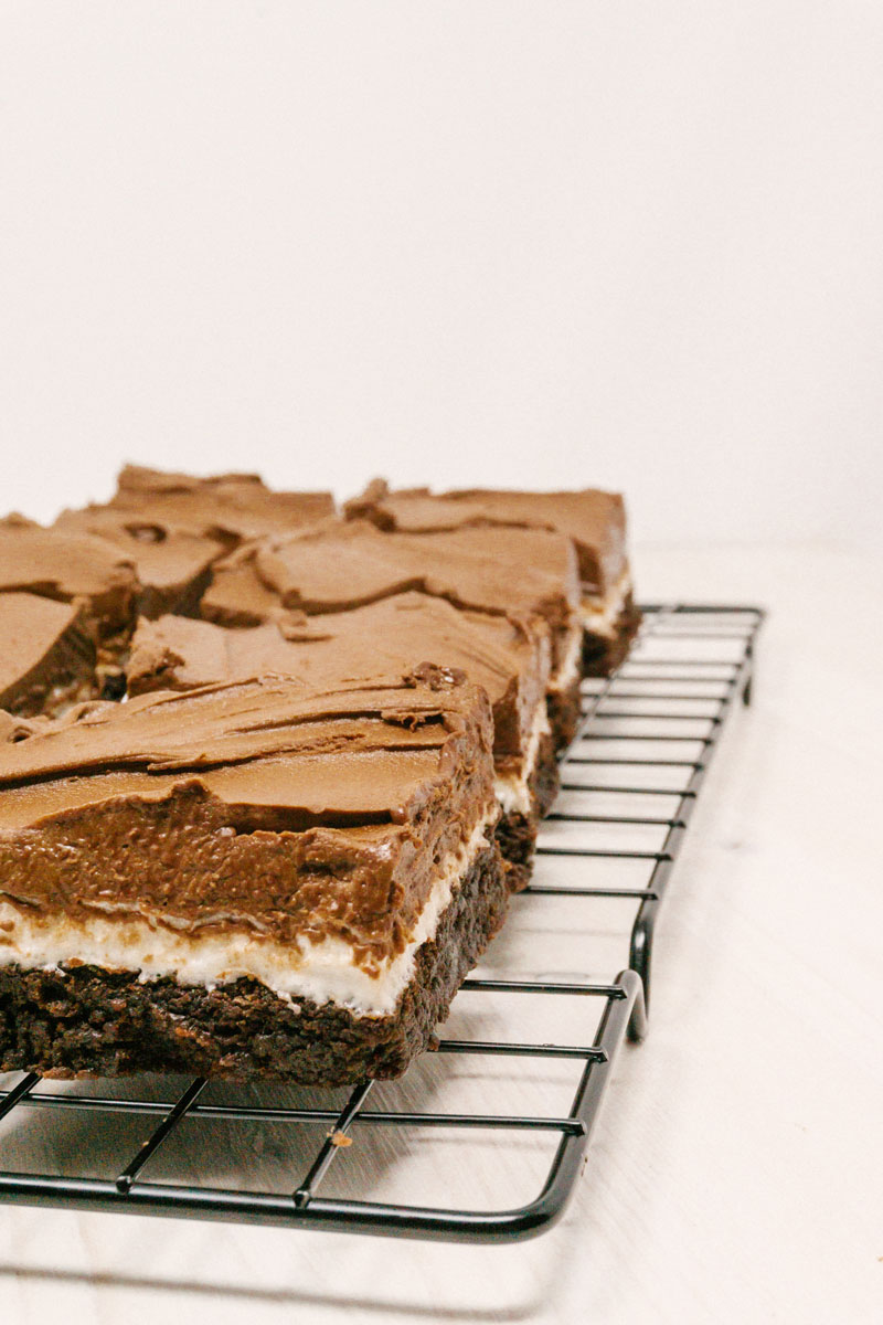 taste before beauty chocolate frosted marshmallow brownie squares on cooling rack