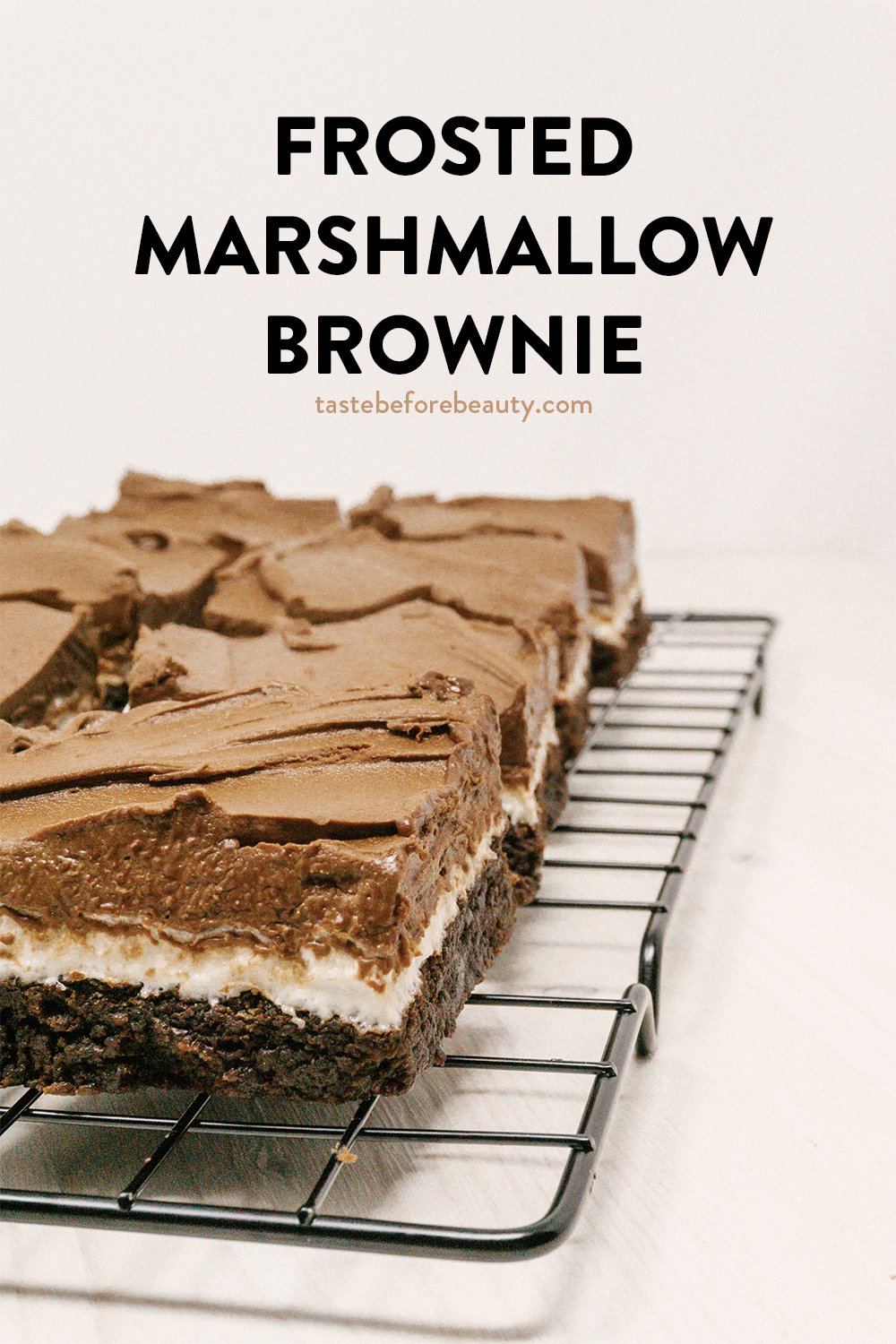 taste before beauty chocolate frosted marshmallow brownies on cooling rack on pinterest pin