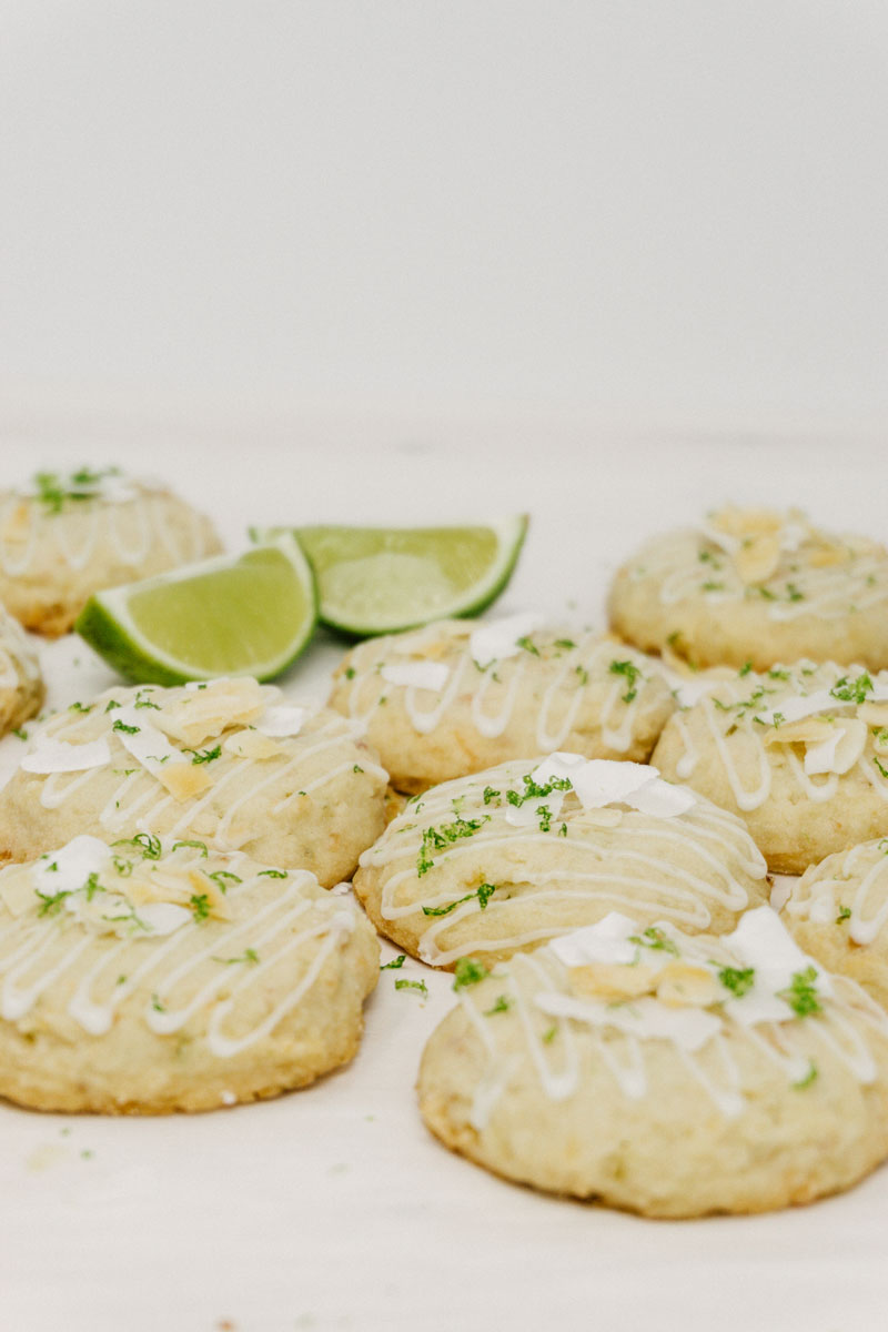 taste before beauty coconut lime shortbread cookies on a table with limes in the background