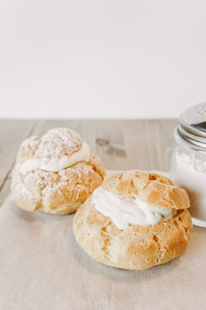 taste before beauty cream puffs with powdered sugar nearby