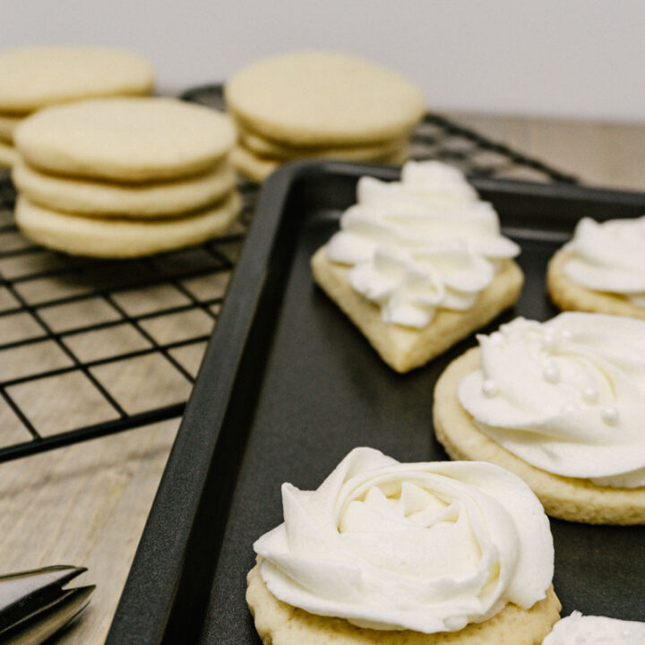 taste before beauty frosted sugar cookies on a pan