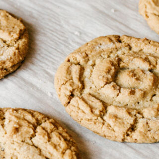 taste before beauty peanut butter cookies on parchment paper