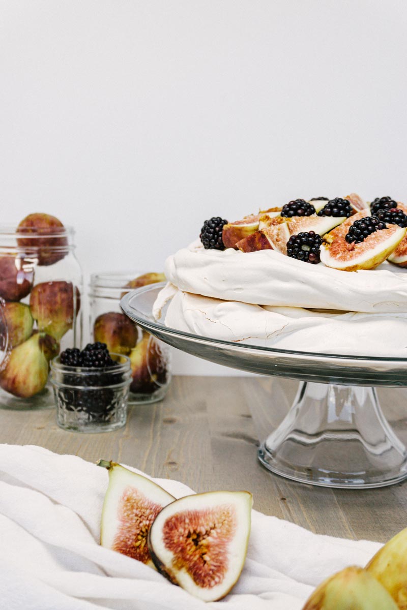 taste before beauty stacked cracked pavlova with berries and figs around