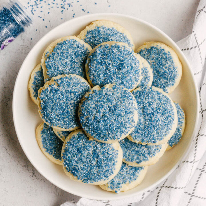 taste before beauty buttery sugar cookies on a plate with blue sprinkles