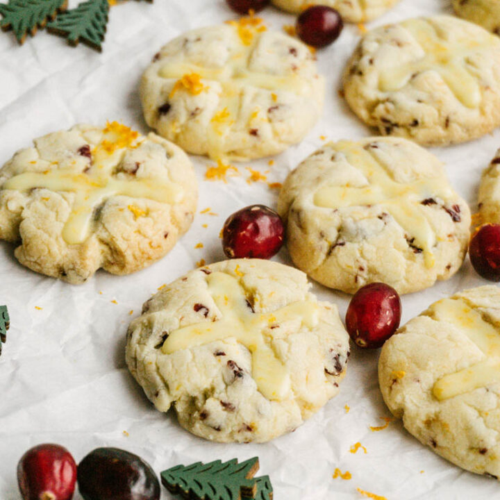 taste before beauty cranberry orange shortbread cookies with wood trees and cranberries layed around