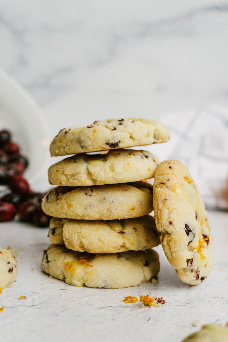 taste before beauty cranberry orange shortbread cookies stacked