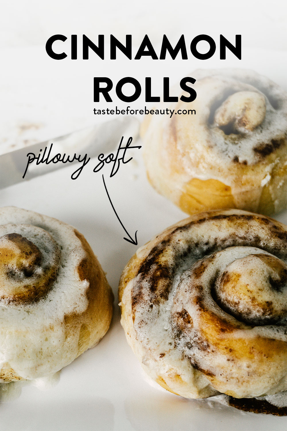 taste before beauty buttery soft cinnamon rolls on a plate with frosting pinterest pin