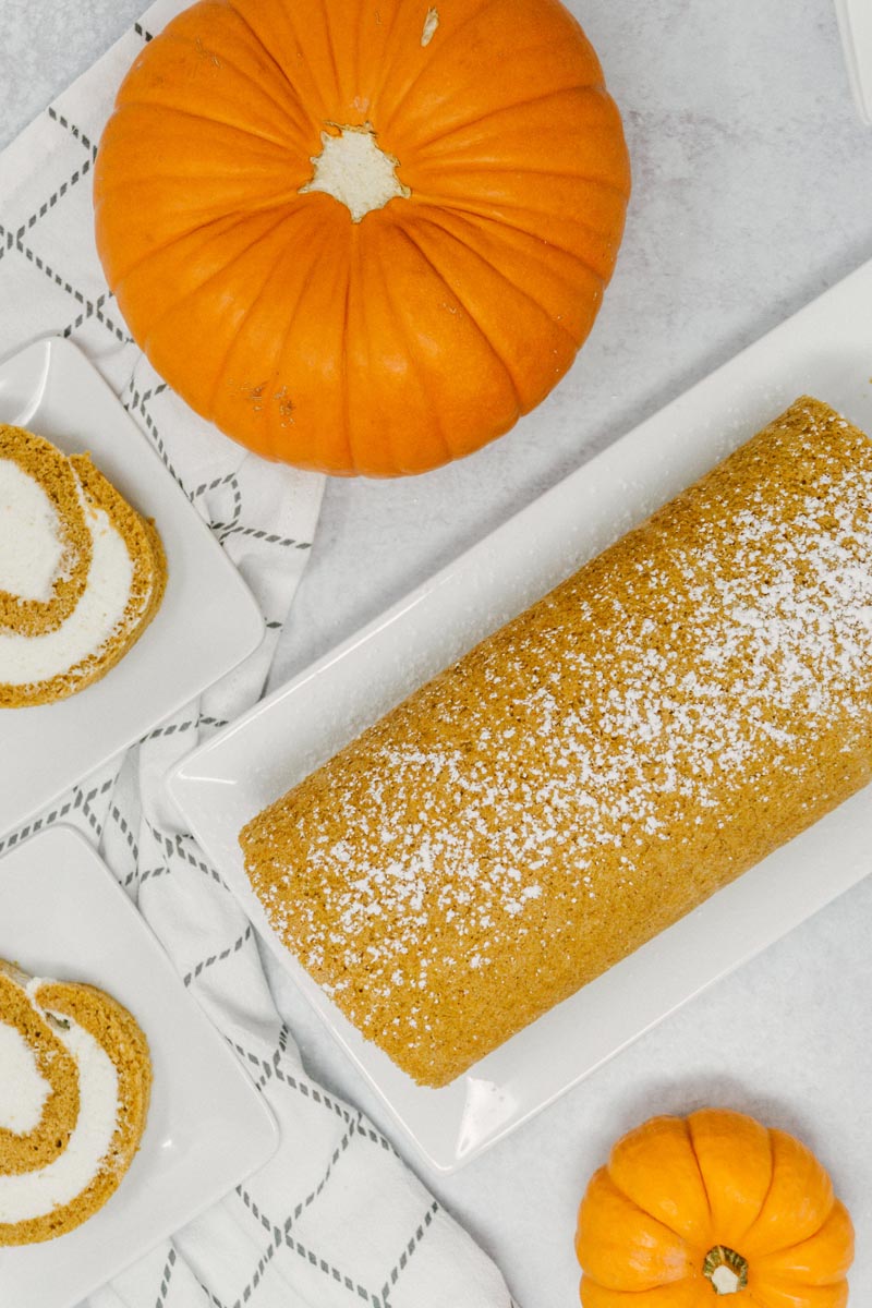 taste before beauty pumpkin roll with cream cheese frosting with pumpkins and slices