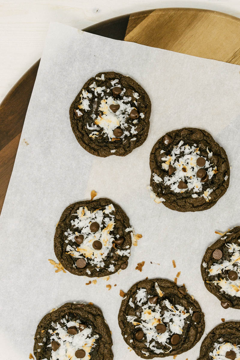 chocolate coconut cookies layed out on parchment paper