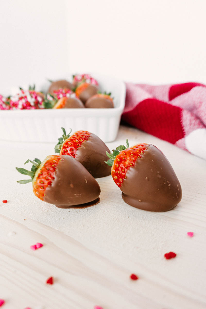 taste before beauty chocolate dipped strawberries on table