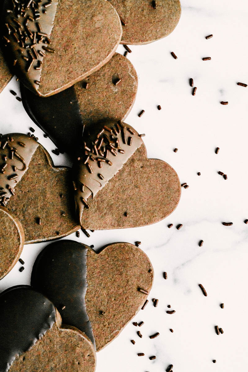 taste before beauty easy crisp chocolate dipped shortbread layed on table with sprinkles