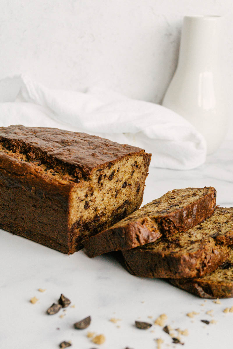 taste before beauty healthy chocolate chip banana bread slices with chips around