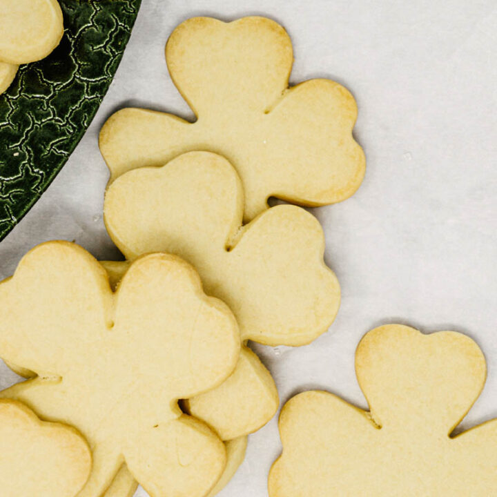 taste before beauty irish butter perfectly crisp shortbread cookies on green plate and parchment paper
