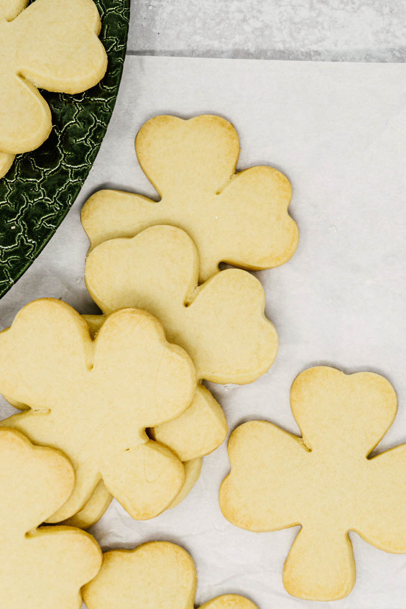 taste before beauty irish butter perfectly crisp shortbread cookies on green plate and parchment paper