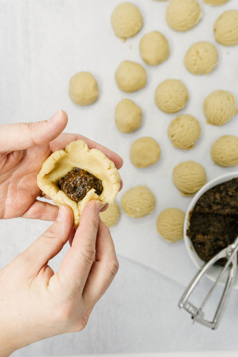 taste before beauty raisin filled cookie dough folding in raisins with hands