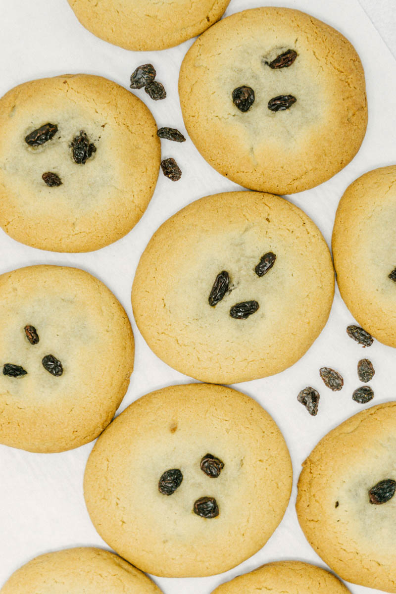 taste before beauty raisin filled cookies spread out on table