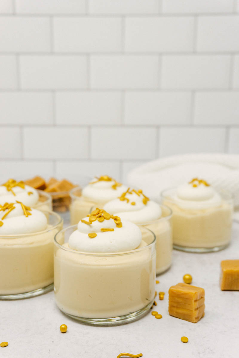 taste before beauty salted caramel mousse in cups on table with caramel squares