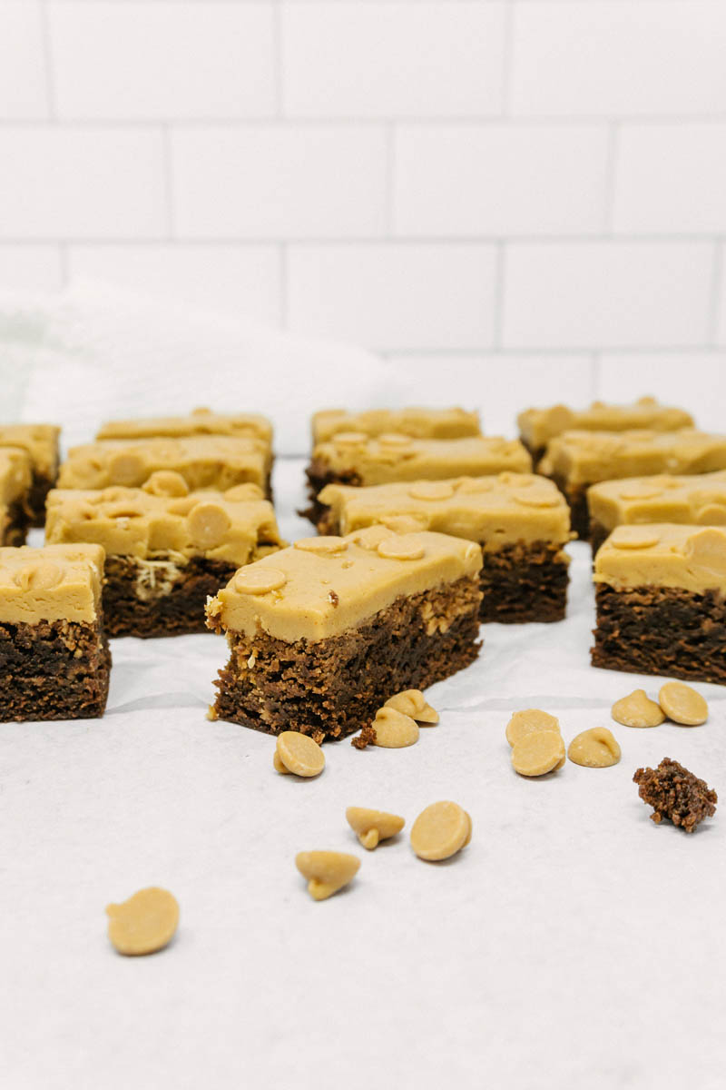 taste before beauty peanut butter brownies on table with peanut butter chips