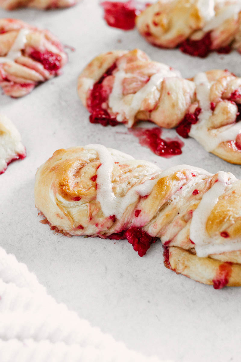 taste before beauty sweet raspberry twists with icing on table