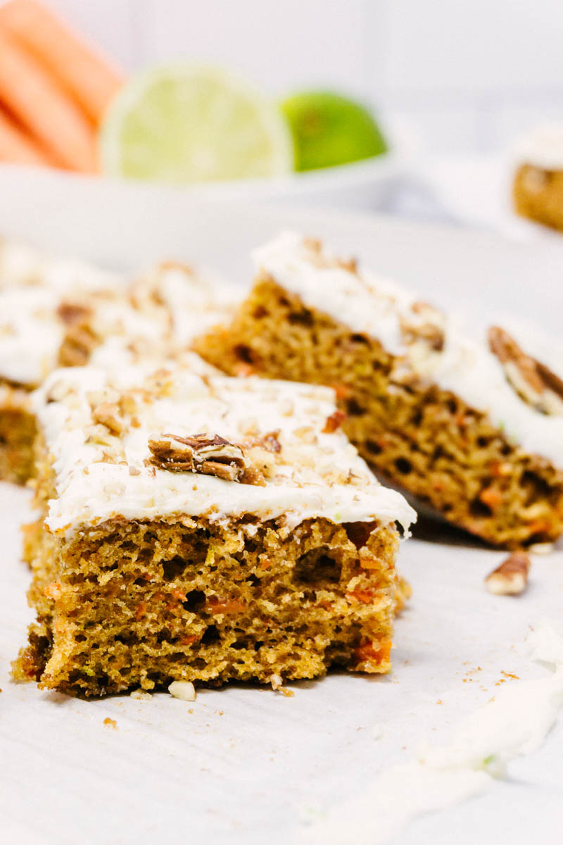 taste before beauty Carrot Cake Bars with Sweet Lime Cream Cheese Frosting layed on table