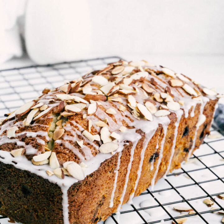 taste before beauty blueberry almond bread on cooling wire with plants and glaze