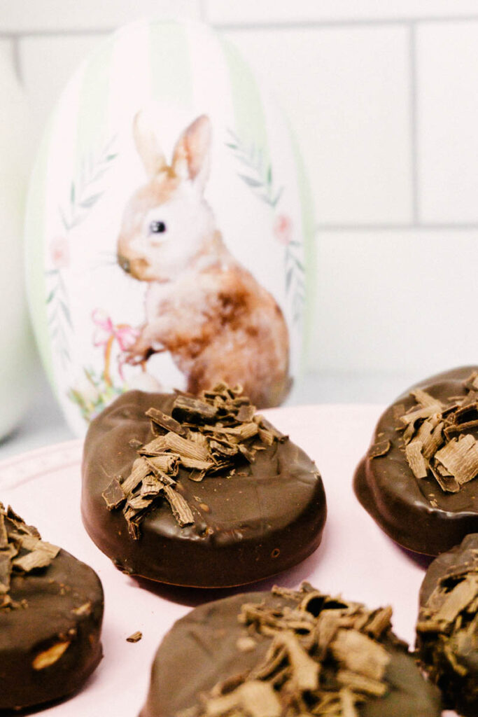 dark chocolate peanut butter eggs on easter plate with bunny