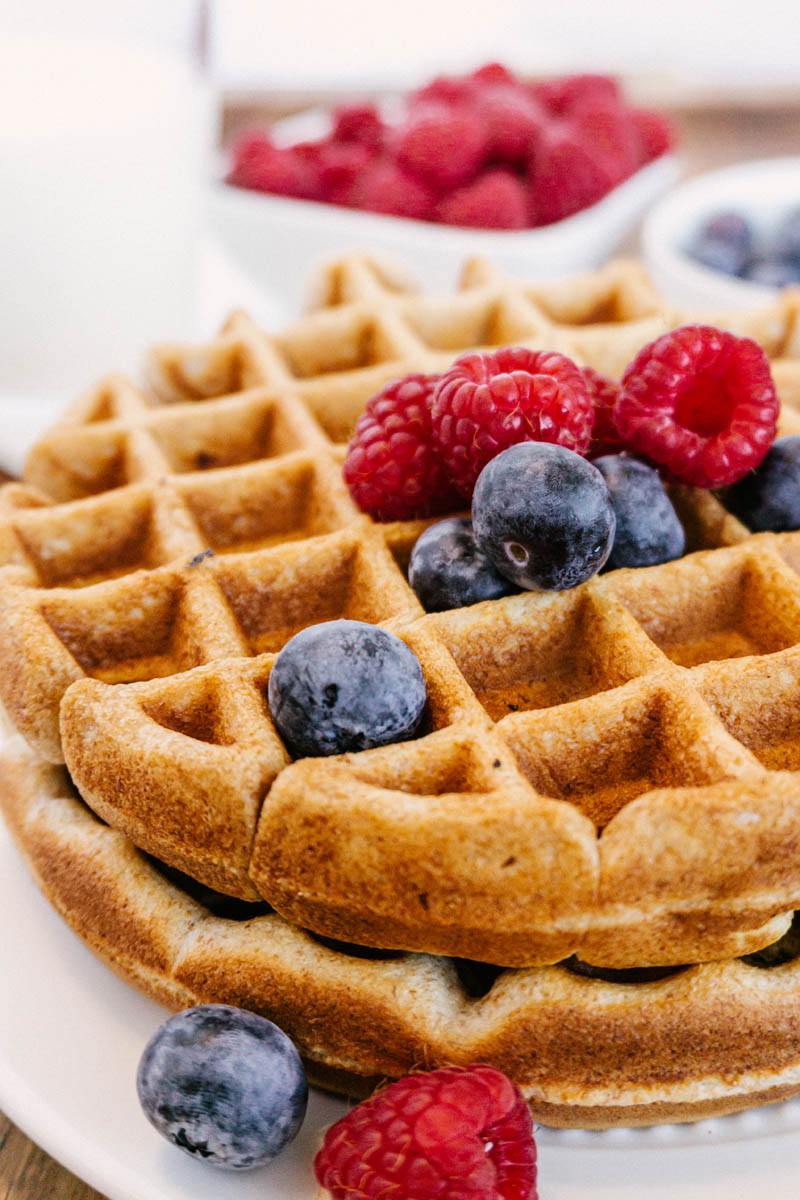 taste before beauty whole wheat waffles on plate with blueberries raspberries milk plain