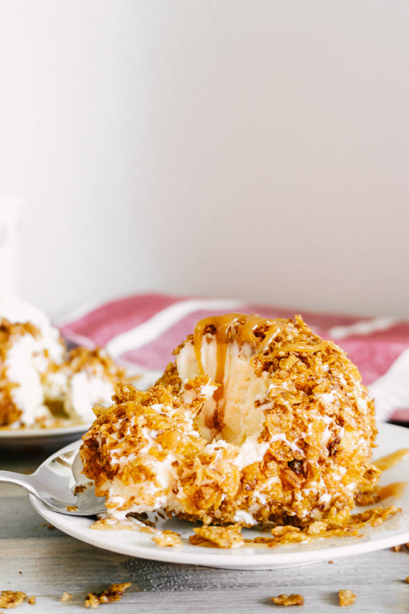 easy fried ice cream balls with cinnamon crunchy coating with spoon