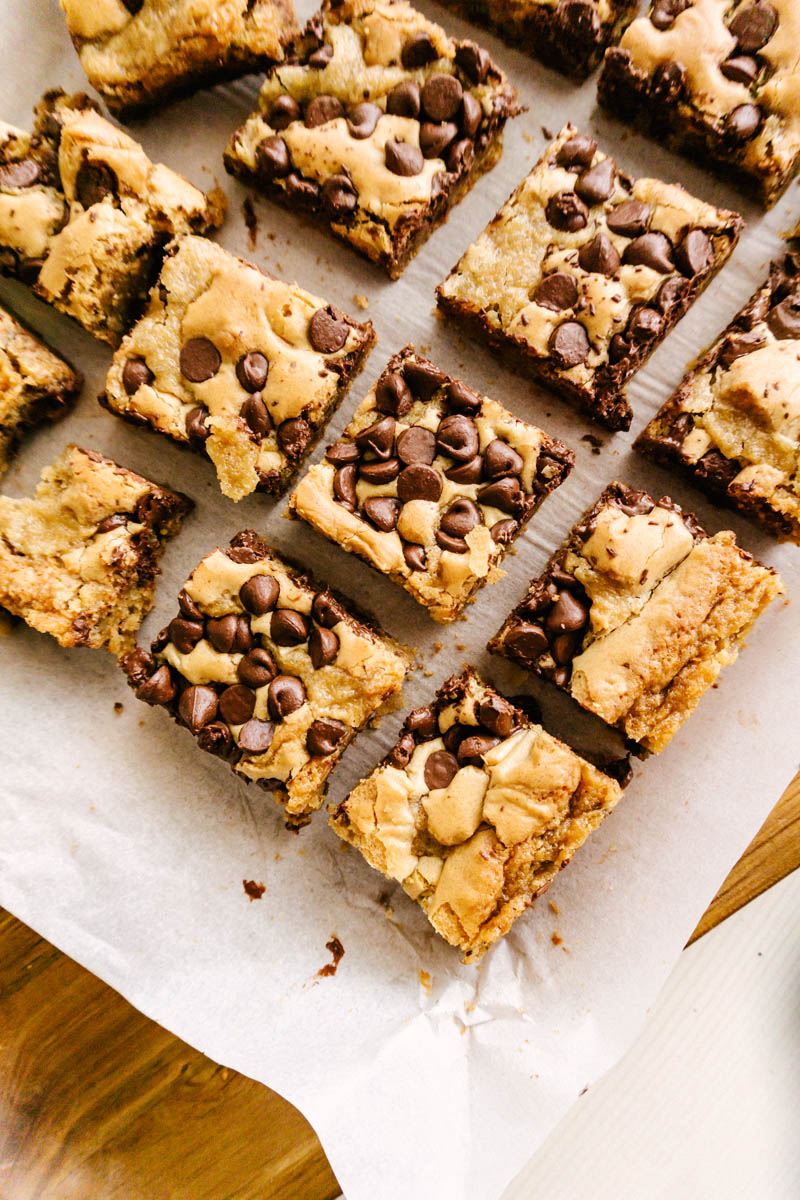 taste before beauty chocolate chip bar squares on cutting board and parchment paper