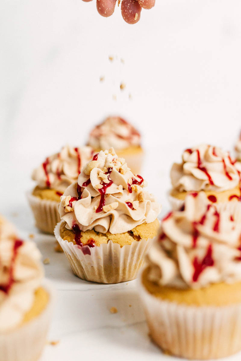 peanut butter and jelly cupcakes with peanut topping