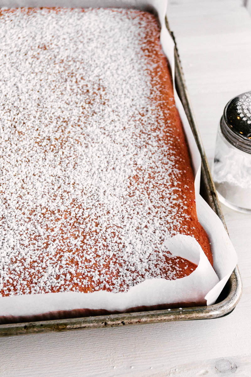 strawberry lemon cake roll base with powdered sugar