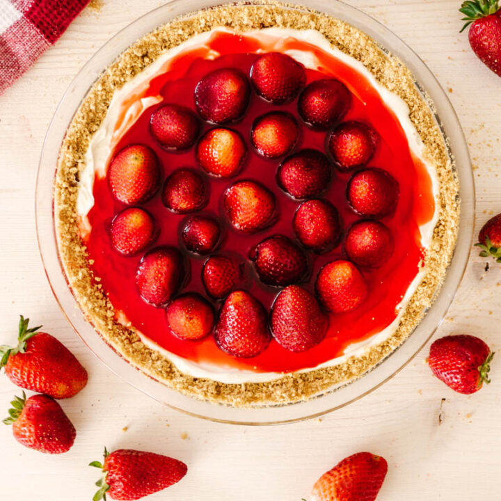 fresh cool strawberry pie on table with strawberries