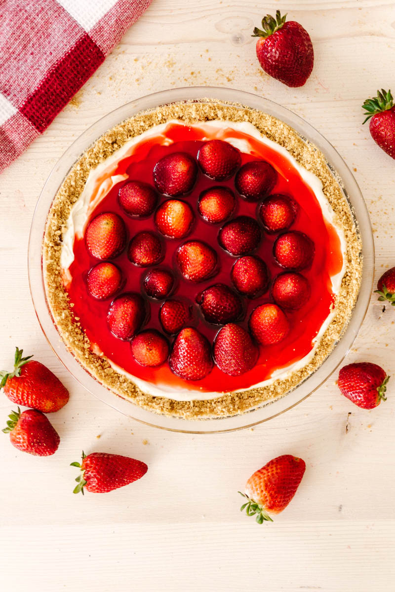 fresh cool strawberry pie on table with strawberries