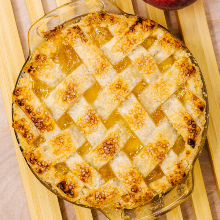 peach pie on wood board