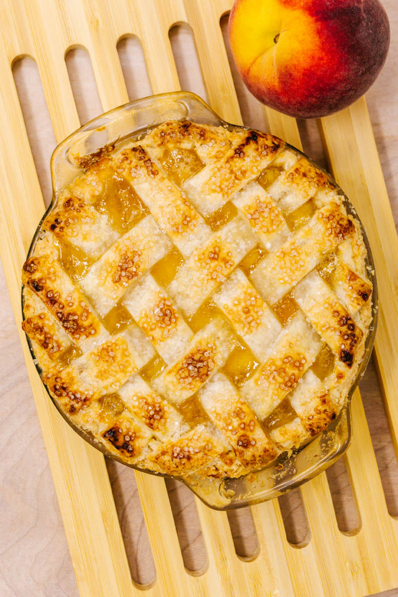 peach pie on wood board