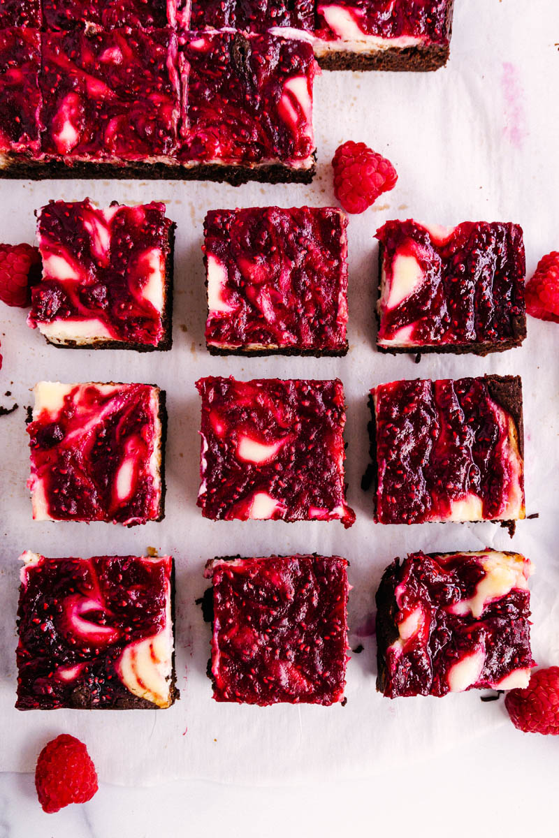 raspberry cheesecake brownies squares spread out