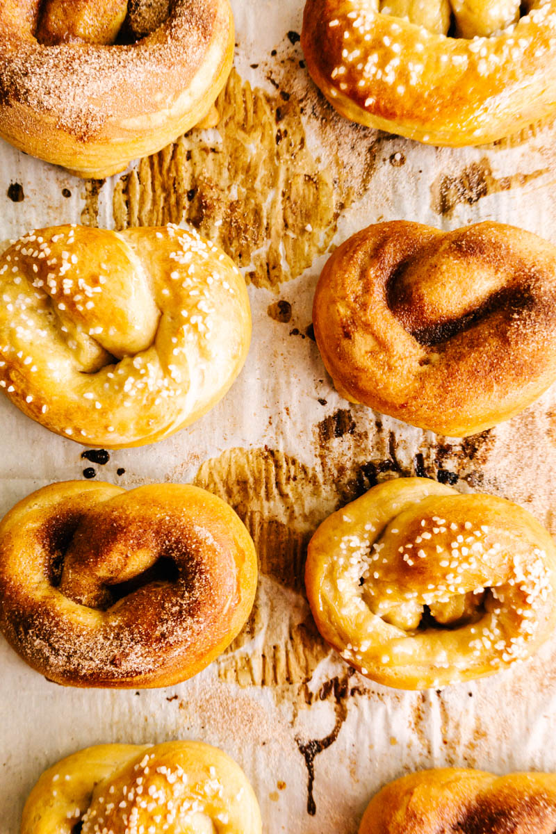 salt and cinnamon soft pretzels on parchment