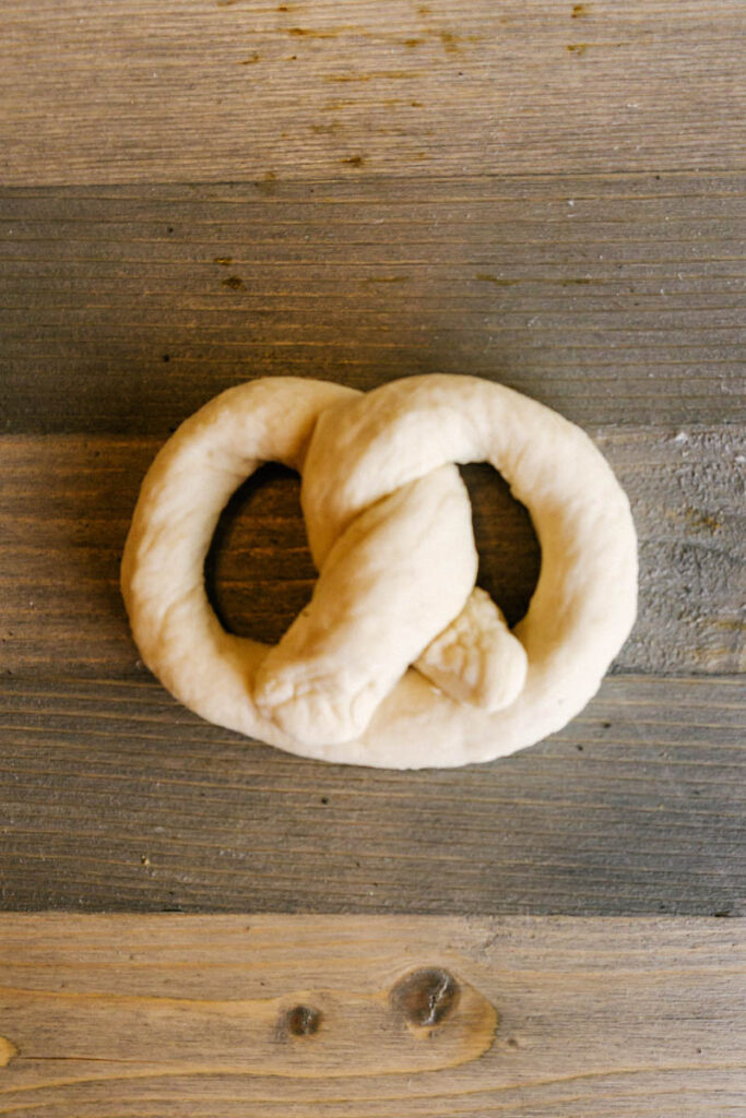 soft pretzel dough twisted into shape back