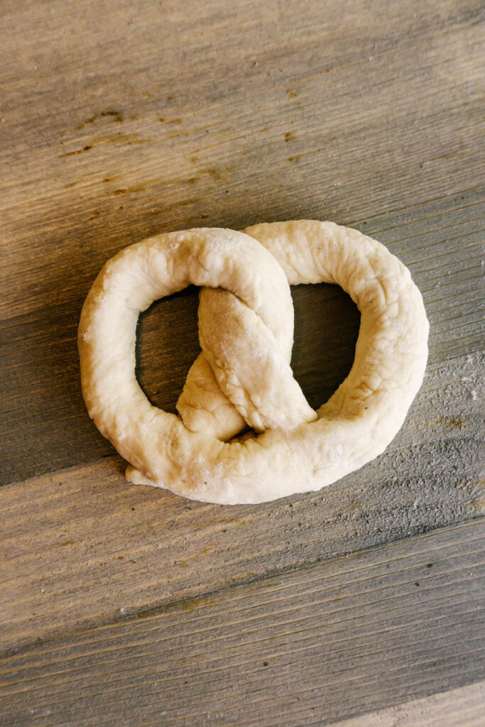 soft pretzel dough twisted into shape back