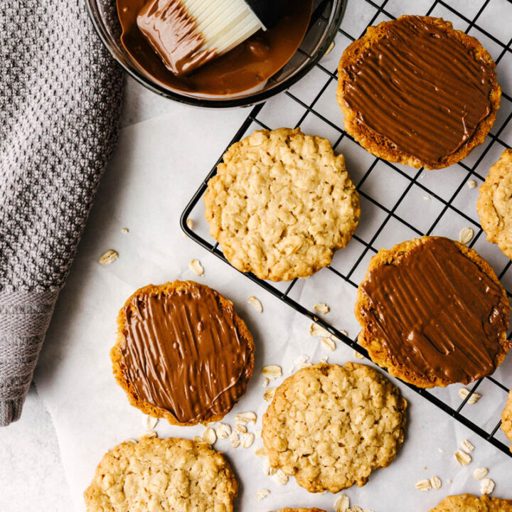 copycat hobnobs oatmeal crumble cookies flatlay on table with chocolate topping