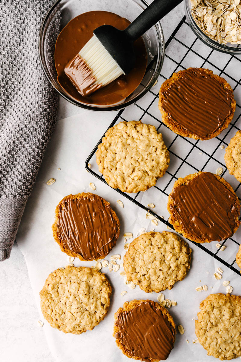 copycat hobnobs oatmeal crumble cookies flatlay on table with chocolate topping