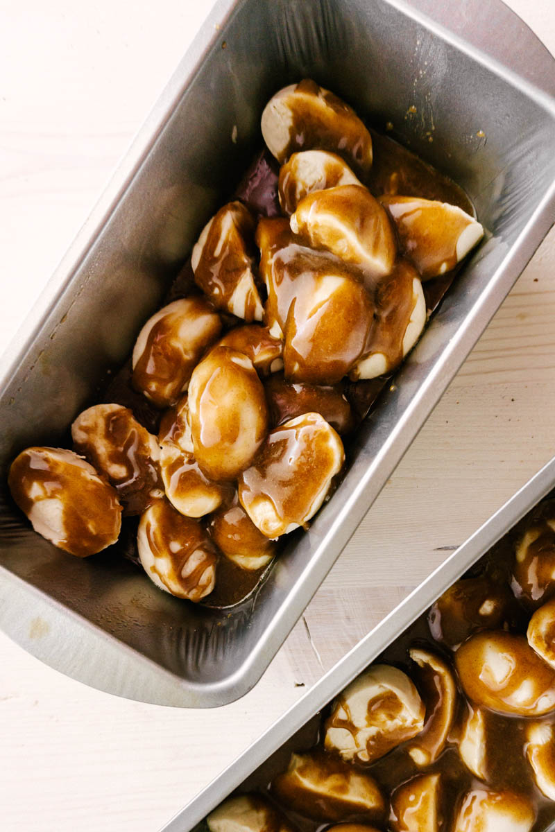 easy monkey bread rolls in pan with drizzle