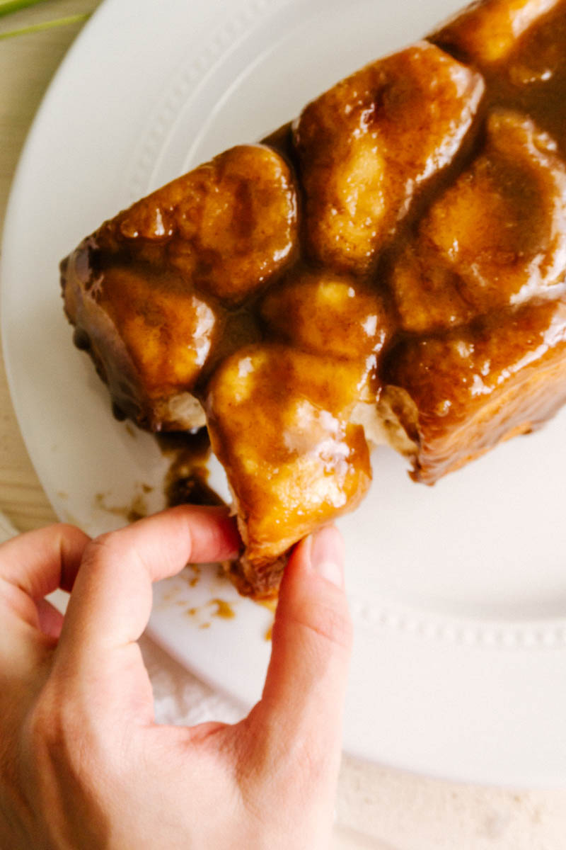 fingers grabbing a piece of the easy monkey bread
