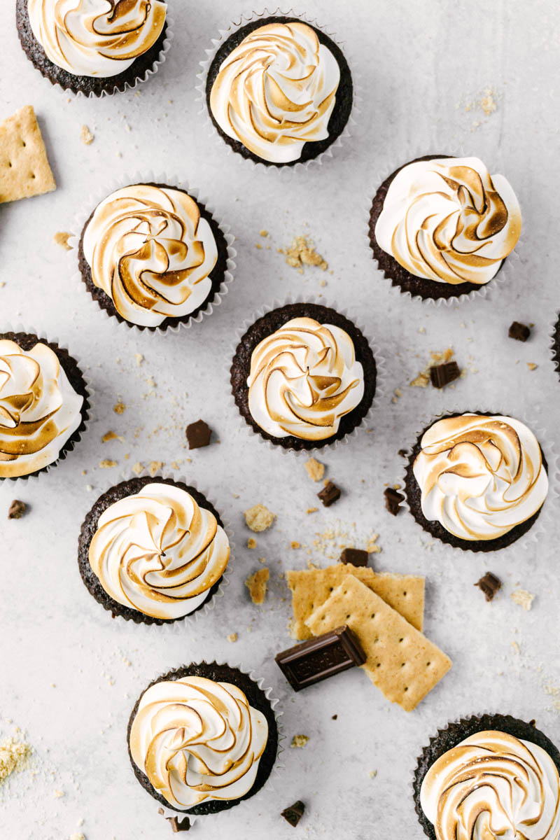flatlay of s'mores cupcakes showing the tops with crumbs around them