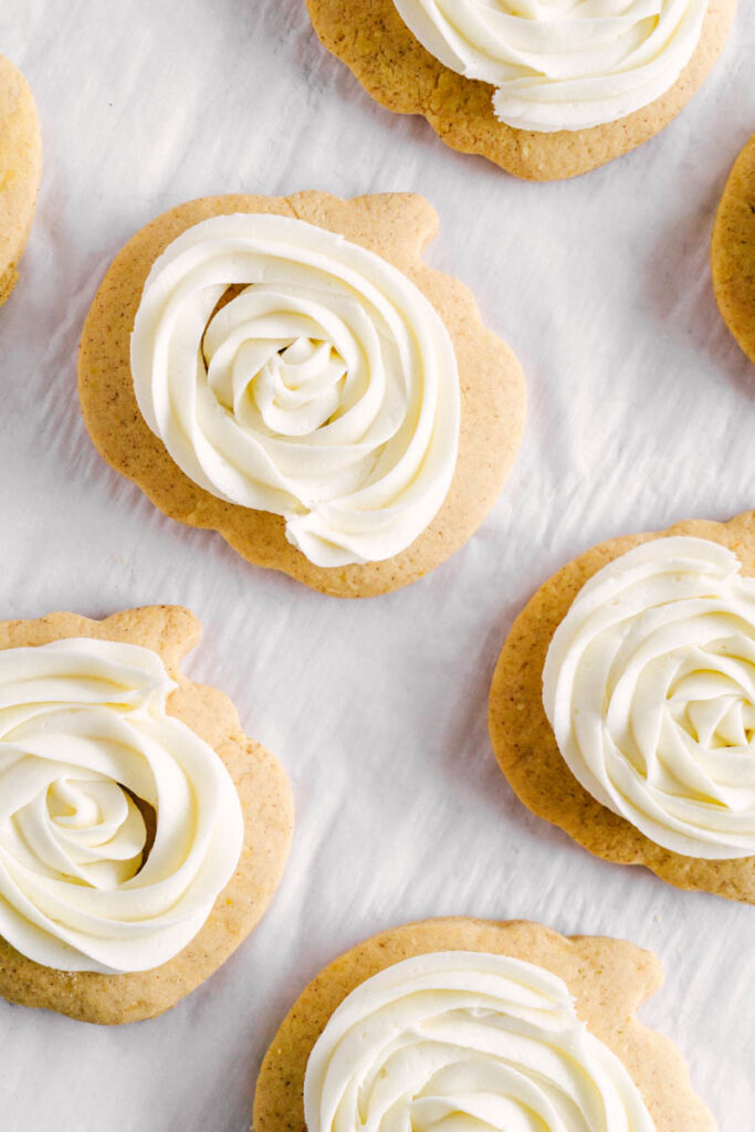 frosted pumpkin sugar cookies flatlay