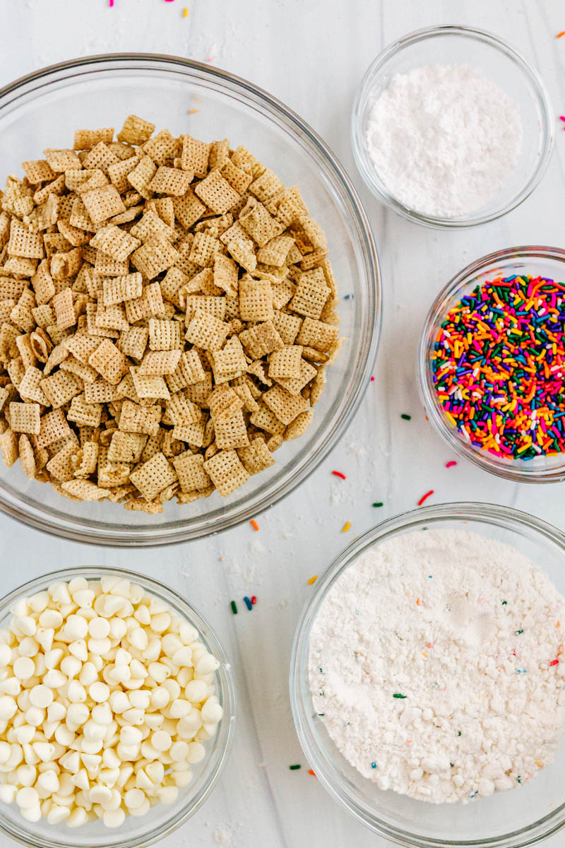 cake batter muddy buddies ingredients in glass dishes