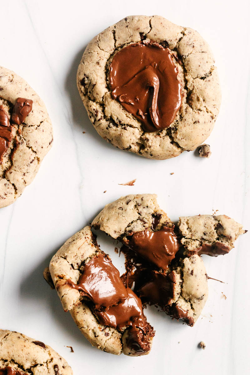 nutella chocolate chip cookies, one whole and one split apart