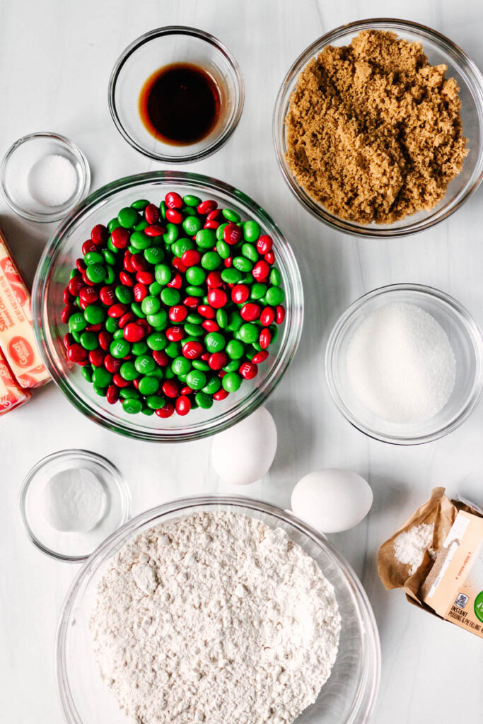 M&M Christmas pudding cookie ingredients in glass bowls