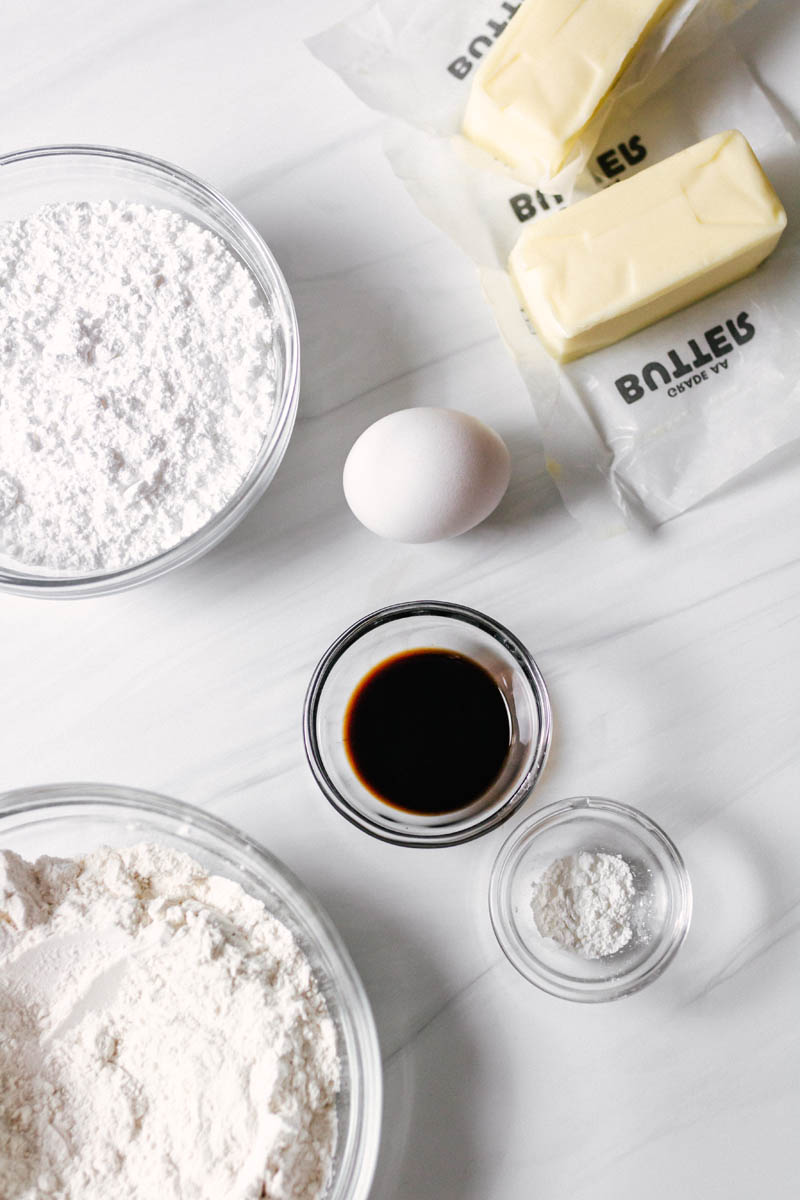 ingredients for the cookies on the table in glass bowls